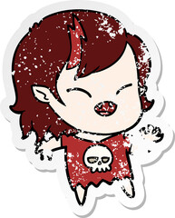 distressed sticker of a cartoon laughing vampire girl
