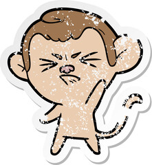 distressed sticker of a cartoon annoyed monkey