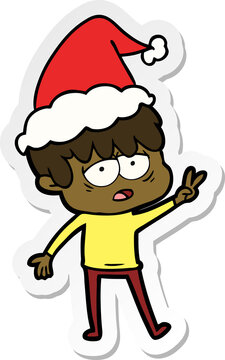 hand drawn sticker cartoon of a exhausted boy wearing santa hat