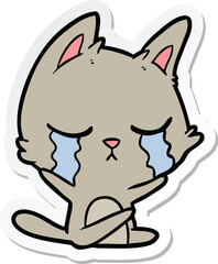 sticker of a crying cartoon cat