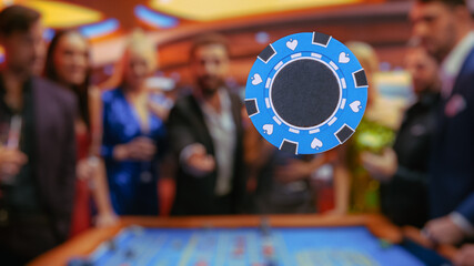Casino Players Making Bets at a Roulette Table. A crowd of International People Enjoying Nightlife...