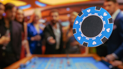 Casino Players Making Bets at a Roulette Table. A crowd of International People Enjoying Nightlife...