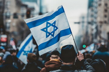 waving israeli flag in a crowd on street