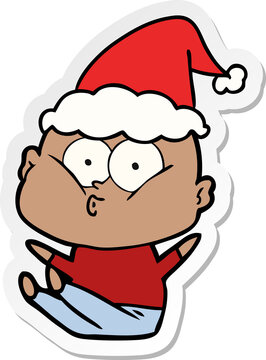 hand drawn sticker cartoon of a bald man staring wearing santa hat