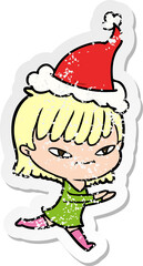 hand drawn distressed sticker cartoon of a woman wearing santa hat