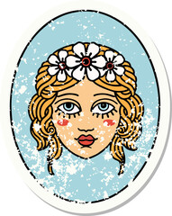 distressed sticker tattoo in traditional style of a maiden with flowers in her hair