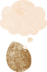 cartoon egg with thought bubble in grunge distressed retro textured style