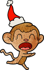 shouting hand drawn textured cartoon of a monkey wearing santa hat