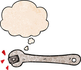 cartoon spanner turning nut with thought bubble in grunge texture style