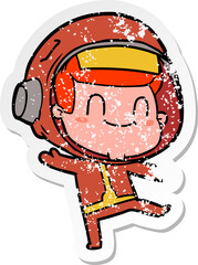 distressed sticker of a happy cartoon astronaut man