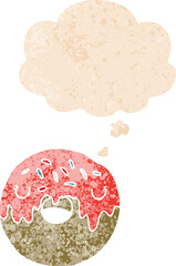 cartoon donut with thought bubble in grunge distressed retro textured style
