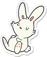 Obraz na płótnie Canvas sticker of a cartoon rabbit sleeping