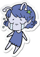 sticker of a cartoon crying alien girl