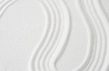 Zen garden, Japanese garden with art line pattern on white sand background,Top Sand Nature texture surface with wave lines pattern,Background  banner for Harmony,Meditation,Feng Shui,Zen like concept