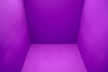 The room features a symmetrical pattern of violet rectangles, with tints and shades of purple, magenta, and electric blue on the walls, floor, and flooring