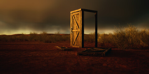 Dilapidated wooden door and frame in desolate desert with cloudy sky.