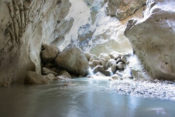 Scenic shot of a river flowing trough a cave in Saklikent National Park, Turkey