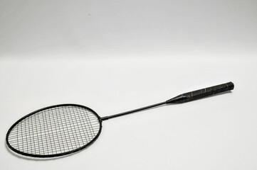 Black badminton racket isolated on white background