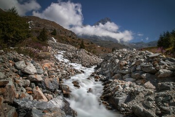Fototapeta na wymiar Closeup shot of a mountain stream on a sunny summer day