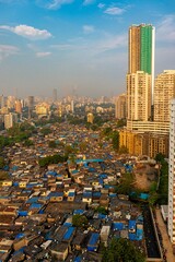 Vertical aerial view of modern buildings and houses in Mumbai, India
