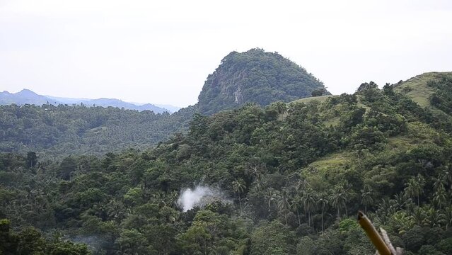 View of Ilijan Hill from an adjacent elevated area. Ilijan Hill is a rare massive volcanic plug made of solid magma found in Tubigon, Bohol, Philippines.
