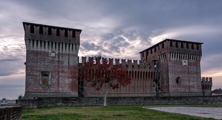 Fototapeta na wymiar Beautiful shot of the historic Soncino's Castle and grounds at sunset in Italy