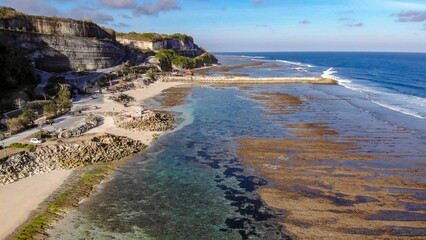 Scenic view of the sea and a rocky beach on a sunny day