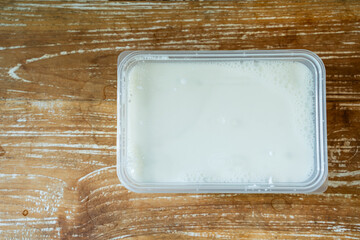 White Plain Yoghurt inside Plastic Box. Ready for Fermentation Process