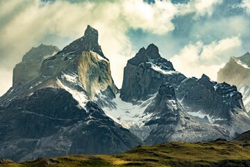 Image of range of high mountains covered with snow in Torres del Paine, Chile - Powered by Adobe