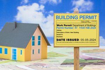The construction industry requires adherence to laws and regulations, including obtaining a building permit, to ensure compliance in real estate projects - Concept with placard and homome model