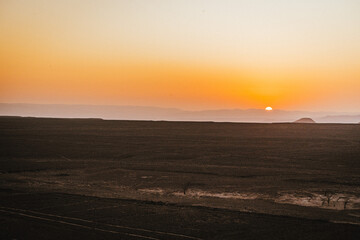 sunset over the Nazca lines in the desert