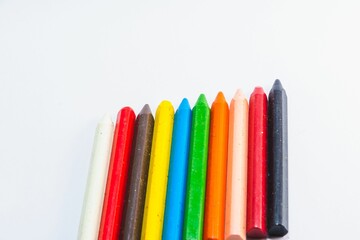 Closeup of colorful crayons isolated on white background