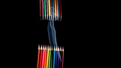 Closeup of colored pencils grouped on black background with white smoke coming from below