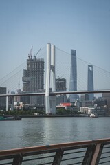 Vertical of the tourist attraction NanPu bridge in Shanghai, China against the blue sky