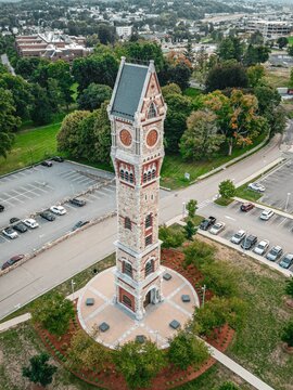 Vertical aerial shot of the Clock Tower in front of a parking lot in Worcester, MA