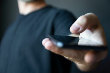 Closeup of a hand holding a smartphone