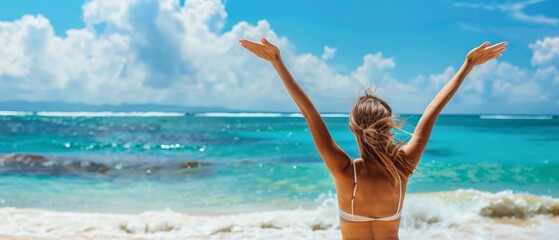 Free happy girl on beach enjoying nature, arms raised high to blue sky, celebrating freedom. Positive reactions of human faces, feeling of success in life, peace of mind concept.
