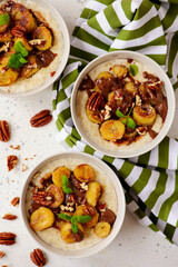 Oatmeal with caramel bananas and chocolate in to the bowl