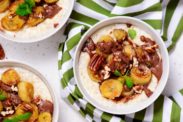 Oatmeal with caramel bananas and chocolate in to the bowl