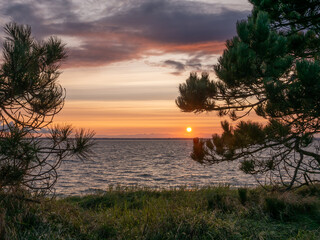 Fototapeta na wymiar Sunset over Kattegat seen from coast on Tuno island, Midtjylland, Denmark