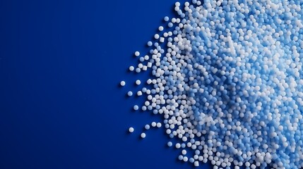 Blue plastic polypropylene granules on a table,