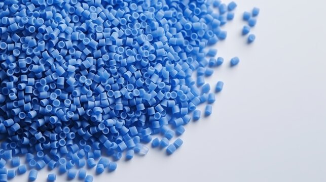 Blue plastic polypropylene granules on a table,