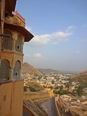 Aerial view of Jaipur city from Amber Fort, showcasing the vibrant colors and architectural beauty.  
