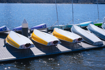 sliding sailboats drying at the pier on a sunny day