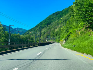 Mountain Road and Alpine Lake Lugano in a Sunny Day in Ticino, Switzerland.