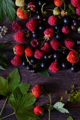 Fresh berries Mix with ice on blue wooden background