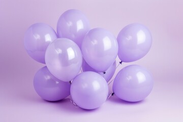 Elegantly arranged balloons in shades of purple against a light purple backdrop
