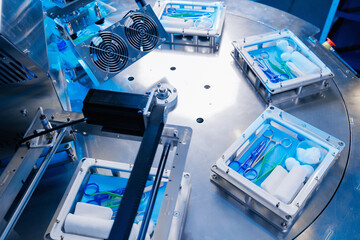 Sterile kit surgical on conveyor belt, top view. Pharmaceutical factory for production of medical...