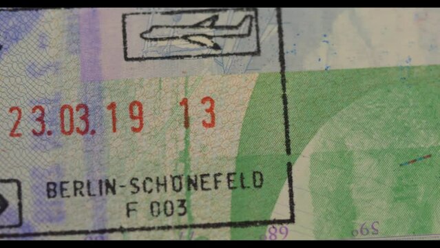 4K Panning shot of Visa Entry Stamp in Passport - Typical Visa on Arrival stamp for holiday makers and tourists to EU European Union Germany and Norway