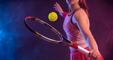 Close-up photo of Tennis player woman with racket on tournament. Girl athlete with racket on open court with neon colors. Download a high quality photo for design of a sports app or tour events. - 776095333